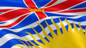 British Columbia flag featuring the Union Jack and a sun emblem, symbolizing local pride and connection to The One Carpet Cleaning services.
